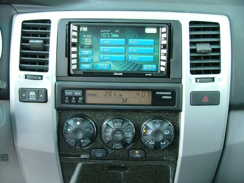 Car dashboard with radio and climate controls.