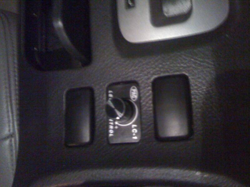 Car dashboard control panel with dial.