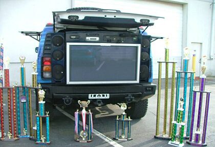 Vehicle with trophies and large screen display.